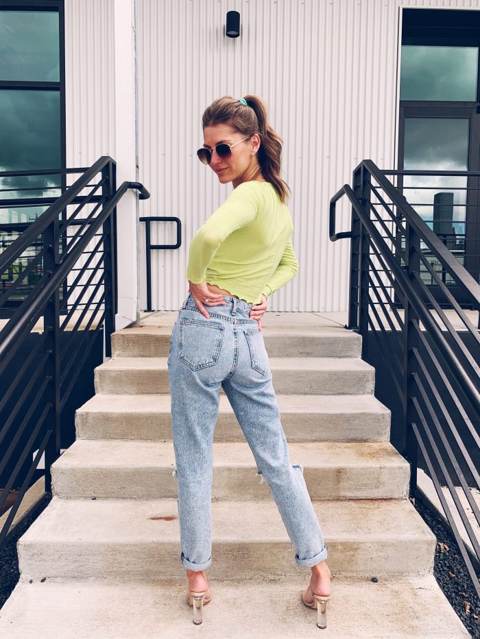 Loving the neon in fall look with high waisted jeans.