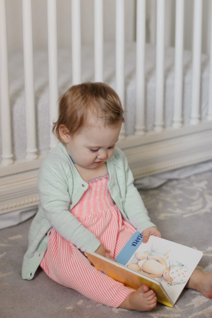 baby reading Walmart book